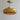 a glass pendant light with yellowish-brown bowl shade