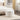 24.41" Ivory Boucle Round Storage Ottoman
