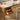 Up close view of storage drawers of wood office desk in natural wood finish