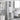 Open drawers, and open doors of tall white bathroom