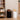 Modern trash bins with swing lids placed in a stylish living room