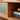 a cherry wood tv stand image, featuring glass shelves and doors