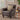 A brown leather accent chair in a modern living room