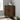 a triangular cabinet image, featuring two doors and an adjustable shelf