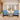 3 Piece Rocking Patio Set Image. Metal Patio Rocking Chairs with Light Blue Cushion and Round Glass-Top Side Table in an Outdoor Setting.