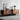 a mid century modern TV stand image, displaying some decorative items on the tabletop