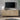 Fluted Sideboard Image. A modern sideboard with 4 Doors and Adjustable Shelves as a TV stand in a living room.