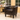 A brown leather accent chair in a modern living room