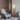 Mid Century Modern floor lamp illuminating a living room corner