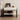 a modern nightstand with sintered stone top and leather detailing image. It displays an art frame and a lampon the tabletop.