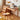 a natural wooden desk with tempered glass top