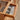 a cherry wood desk with drawers