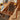a cherry wood desk with tempered glass top