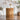 Round Fluted Side Table Image. Round side table with Vertical Texture Relief in Natural in a living space.