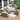 8 Piece Patio Set Image. Sectional 8 piece outdoor furniture set with Beige Cushioned Wicker Rattan Rocking Chair and Storage Table in an outdoor setting.