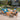 4 Piece Patio Set Image. 4 piece patio conversation set with Removable Cushion Covers in teal blue and brown in an outdoor setting.