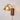 a vintage plug in wall sconce with glass lampshade and wooden base