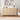 Boho rattan cabinet next to armchair with soft lighting