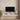 Floating TV stand with cabinet doors open showing internal compartments and cable holes.