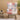 Front view of pastel patchwork rocker chair in cozy living room setting