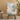 Rocking chair in cozy living room setting with light wood floor and round side table