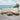 Patio sectional set with ocean view background