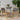 Set of two McGill rope-woven outdoor chairs placed on patterned outdoor rug with lemon tree in background