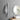 Silver vertical wall coat rack in bathroom with towel