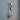 Wall mounted silver coat rack with scarf and purse