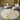 Circular Light Khaki & Gold Area Rug with sofas and a lamp