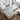 wide angle view of white sofa with lamp