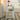 White end table with decorative items.