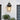 a modern aluminum black outdoor wall light in an outdoor setting