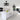 a black enclosed ceiling fan image, hanged atop a chic kitchen island