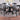 A black round dining table and 4 matching dining chairs