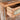 Rustic Nightstand Image. Close up view of reclaimed wood nightstand in a distressed wood finish showcasing its drawer interior