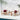 3 Piece Outdoor Furniture Set Image. 3 piece patio set with Cream Adirondack-Inspired Cushioned Chairs and Side Table by the pool side.
