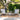 3 Piece Outdoor Furniture Set Image.  3 Piece Patio Set with Grey Adirondack-Inspired Cushioned Chairs and Slatted Top Side Table in an outdoor setting. 