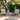 3 Piece Outdoor Furniture Set Image.  3 Piece Patio Set with Grey Adirondack-Inspired Cushioned Chairs and Slatted Top Side Table in an outdoor setting. 