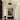 a glass pendant light in a hallway