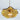 Ceiling mounted amber glass pendant light showing, amber glass floral lamp shade, light bulb, and brass lamp holder