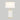 Full view of Ivory Ceramic table lamp turned on with rectangular base and lampshade