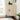 a triangular cabinet image, featuring two doors and an adjustable shelf