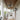 a farmhouse caged ceiling fan image, featuring a black metal frame, and 5 bulb lights 