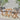 3 Piece Bistro Set Image. 3 Piece outdoor furniture set in Brown and Black with Round Table in foldable design in an outdoor setting