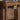 Closeup view of the cable management hole in drawer of walnut wood office desk