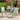 3 Piece Outdoor Furniture Set Image. Green 3 Piece Patio set in Powder Coated Iron with Round Side Table in an outdoor setting.