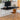 a black writing desk with a matching chair