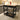 Black Kitchen Island with fruit bowl, open book and red bottle on top - Charmydecor