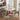 a round wood dining table with 2 dining chairs